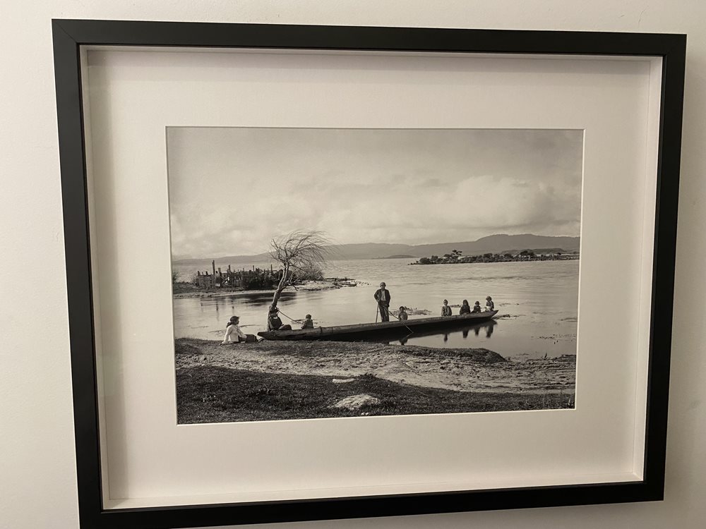 Historical photo of Maori Children in a Waka on the shore of Lake Rotorua, New Zealand. Circa 1905