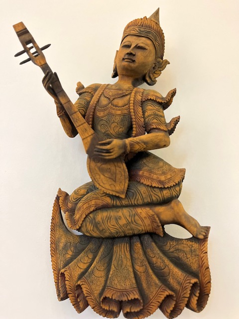 Thai traditional wooden carving of a musician